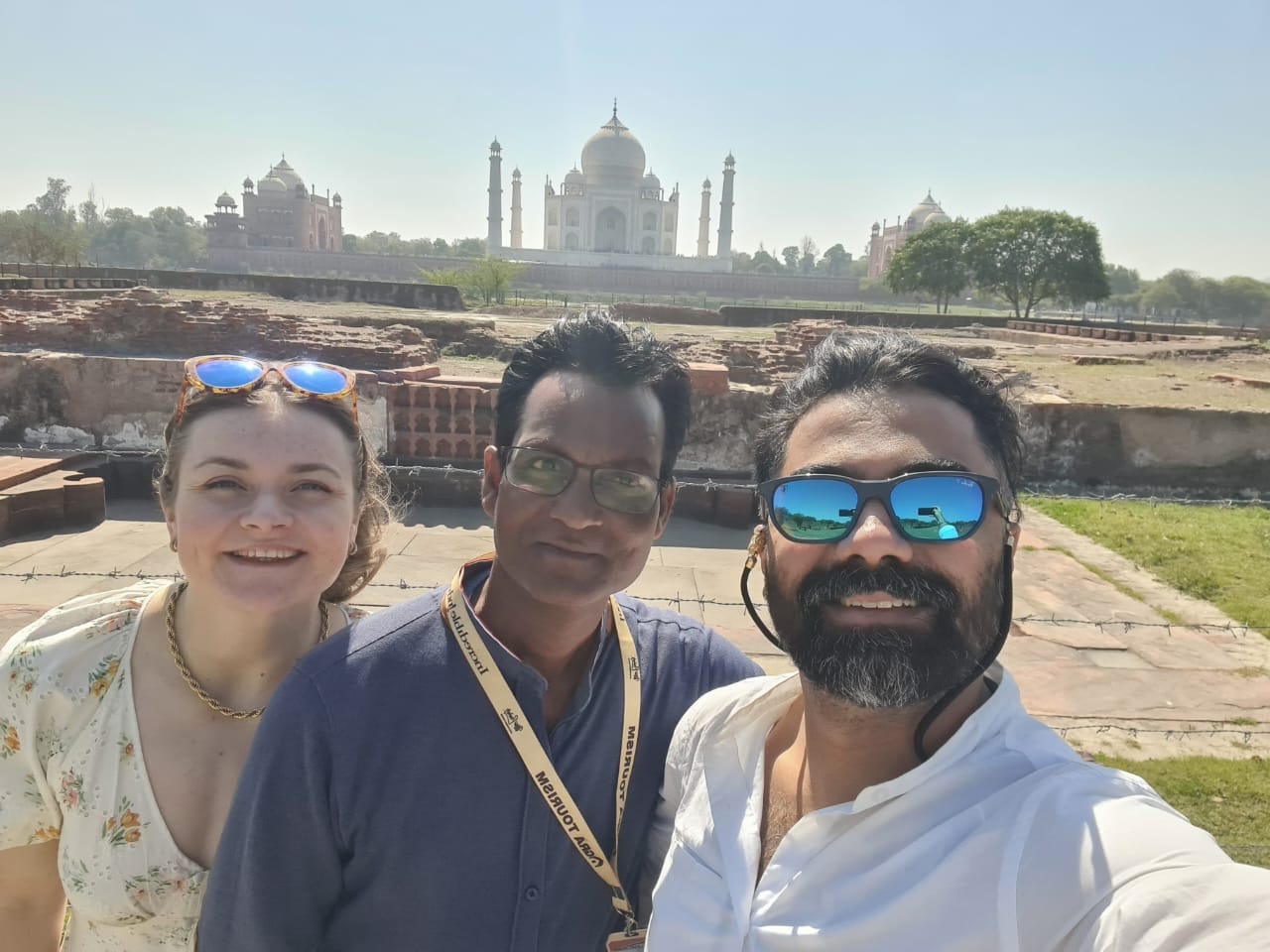 Mr. Verma with tourists smiling